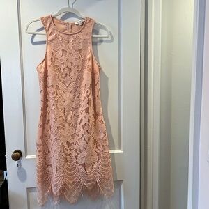 Francesca’s light peach lace dress.
